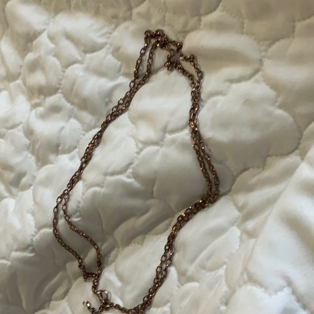 i am selling a golden double necklace (not 100% gold)